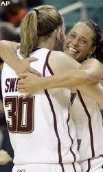 Senior Corey Rusin celebrates with sophomore Carolyn Swords after Boston College captured a 76-59 win over Miami in the first round of the ACC Tournament.