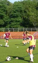 Junior Hannah Cerrone receives a pass during drills at the second day of training at the Newton Soccer Complex.