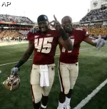 Wes Davis and Clarence Megwa celebrate the Eagles' victory. (AP Photo/Winslow Townson)