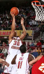 Dallas Elmore drives to the basket in the Eagles' game against Maryland.