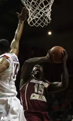 Boston College's Rakim Sanders, right, tries to shoot past the defense of Virginia Tech's Victor Davila, left, during the first half of an NCAA college basketball game in Blacksburg, Va. Saturday Jan. 23, 2010. (AP Photo/The Roanoke Times, Matt Gentry)