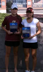 Doubles partners Erina Kikuchi and Alex Kelleher displays their championship plaque.