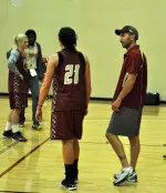 Coach Geoff Lanier and freshman Kristen Doherty talk between drills.
