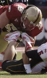 Maryland quarterback Danny O'Brien fumbles as he is taken down by Boston College defensive tackle Damik Scafe during first half action.