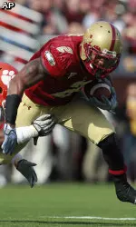 Boston College running back Montel Harris breaks away from Clemson linebacker Corico Hawkins.
