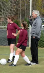 Assistant Coach Mike LaVigne talks with Alyssa Pember and Marissa Mello in Cary, NC at the College Cup.