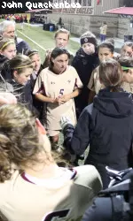 Coach Alison Kulik addresses her team after the win over Wisconsin in the NCAA Tournament.