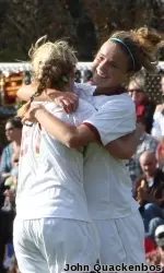 Kristie Mewis and Kate McCarthy hug after a goal by Mewis in the 6-1 win over Marist on Sunday afternoon.
