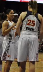Stefanie Murphy discussing defensive issues with Suns teammate Kara Lawson.
