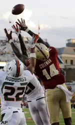 Johnathan Coleman jumps up to catch a pass during the second half. (AP Photo/Elise Amendola)