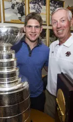 Ben Smith alongside Jerry York and the Stanley Cup.