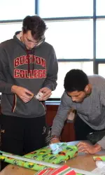 Members of the men's basketball team helped out at the annual athletics Adopt-a-Child wrapping party.