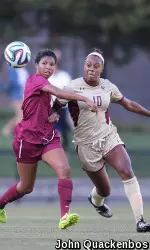 Allyson Swaby fights to keep the ball from Harvard's Margaret Purce during the 2-0 win by the Eagles.