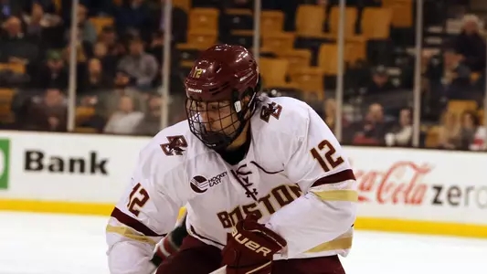 Alex Tuch reaching for puck