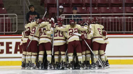 Team huddle around net