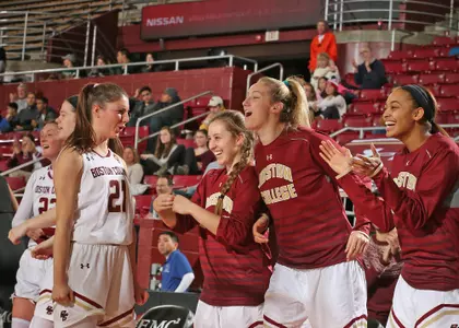 Marti Mosetti leads the bench in celebration