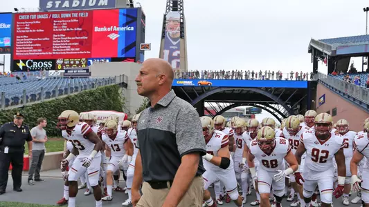Coach Addazio leads the team out of the tunnel