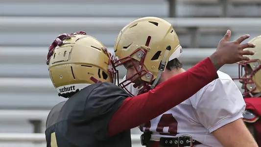 Darius Wade (4) and Tommy Sweeney (89) celebrate