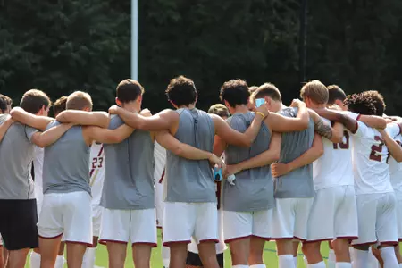 Men's soccer huddle