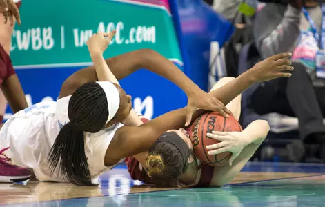 Andie Anastos fights for a loose ball