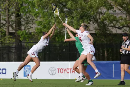 Sheila Rietano & Dempsey Arsenault battle for the ball