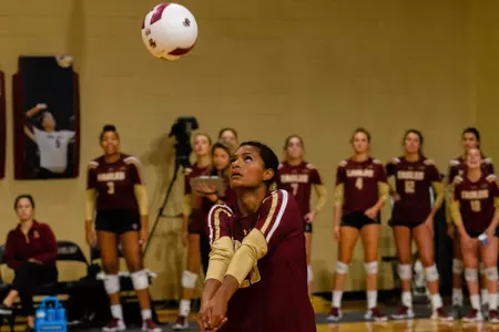 Jewel Strawberry digs a ball against Pitt