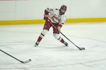Willow Corson shoots the puck during a game.