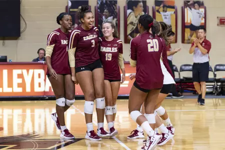 The volleyball team celebrates a point in Power Gym