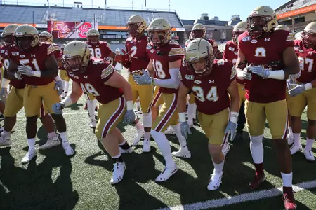 Football players complete warm-ups ahead of their game vs. NC State.