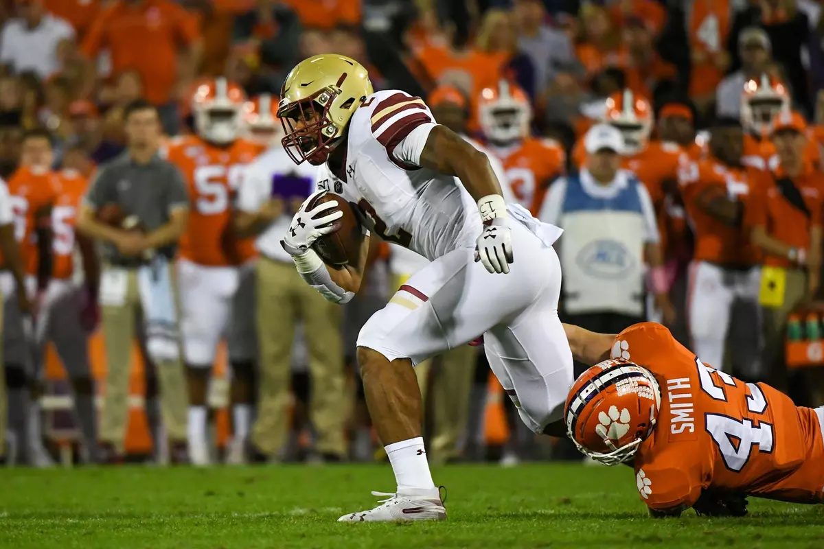 AJ Dillon tries to break away from a tackle at Clemson.