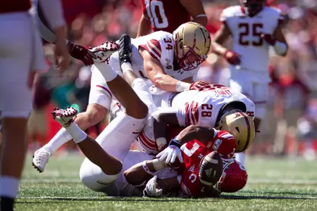 Brandon Barlow and John Lamot force a fumble at Rutgers.