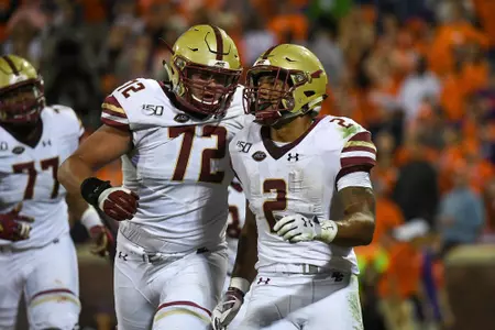 AJ Dillon, Alec Lindstrom celebrate a touchdown at Clemson