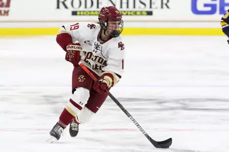 Hannah Bilka rushes the puck up the ice against Merrimack.