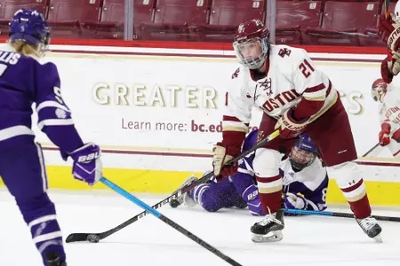 Bridget McCarthy fights for the puck against Holy Cross.