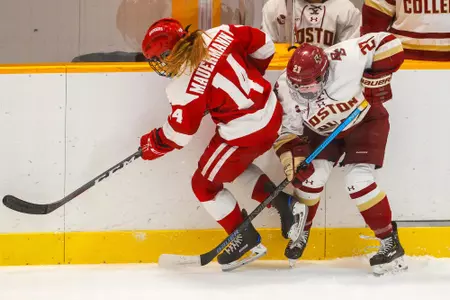 Cayla Barnes fights for the puck against Wisconsin.