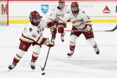 Caroline DiFiore rushes the puck up against the ice in a game against Providence.