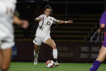 Michela Agresti dribbles the ball up the field against Clemson.