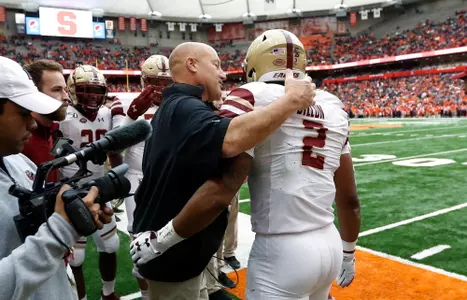 Head coach Steve Addazio congratulates AJ Dillon on his record-breaking touchdown.