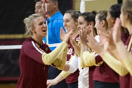 Jane DeJarld high-fives teammates for starting lineups against Notre Dame