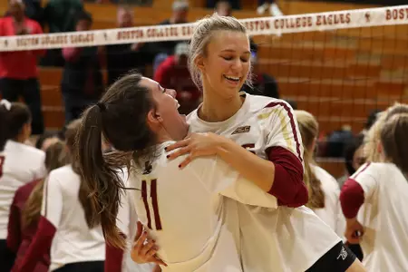 Cat Balido and Jane DeJarld hug after winning their final regular season match against NC State