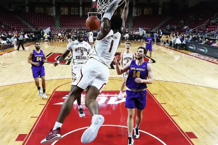 BC's Jairus Hamilton dunks the ball and Jay Heath jumps for joy.