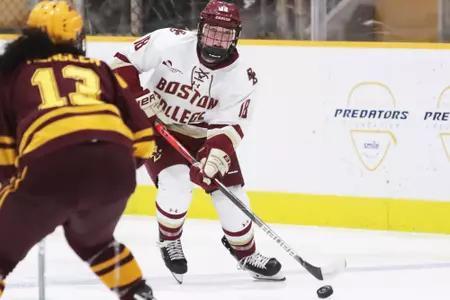 Kelly Browne skates the puck up the ice against Minnesota.