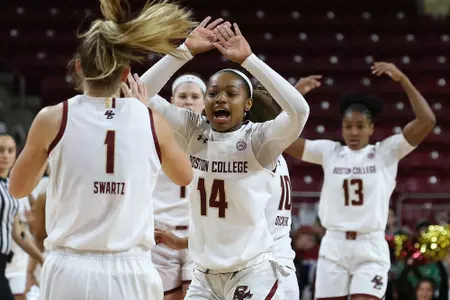 Marnelle Garraud celebrates with Cameron Swartz in the win over Delaware State on Dec. 20, 2019.