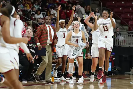 The bench celebrates in the win over Delaware State.
