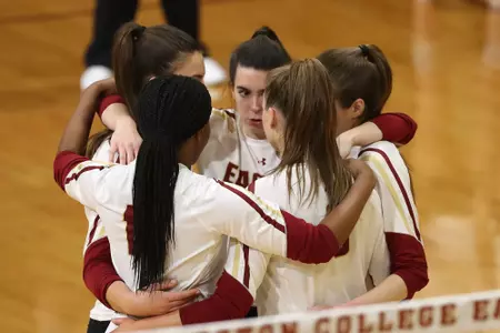 The volleyball team huddles against NC State