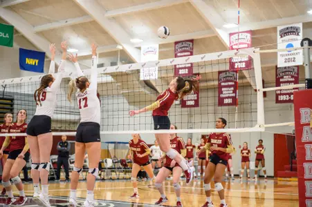 Cat Balido jumps for an attack at Colgate