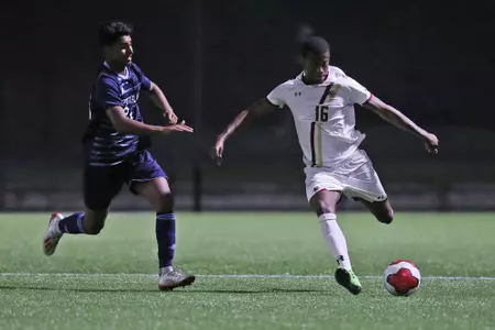 Tyshawn Rose clears the ball a Rhode Island midfielder