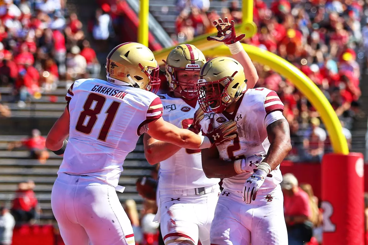 AJ Dillon celebrates a touchdown at Rutgers
