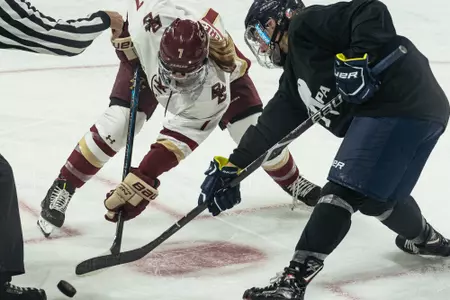 Maegan Beres take a faceoff.