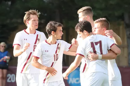 Lasse Lehmann, Amos Shapiro-Thompson, Stefan Sigurdarson, Beta Luna congratulate Joe Kellett after he scored on a PK vs. UMass
